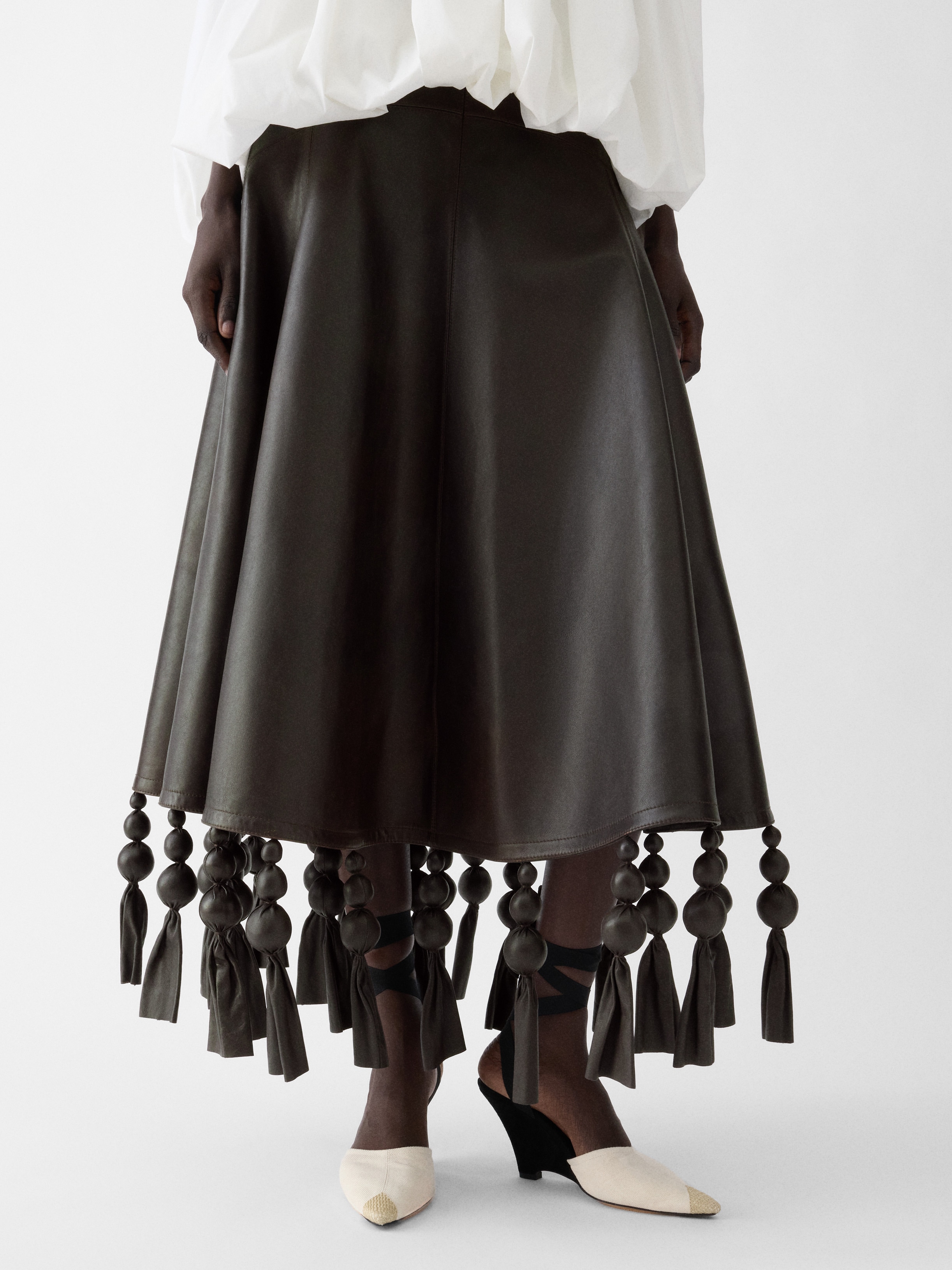 LA JUPE TRIANGLE CUIR